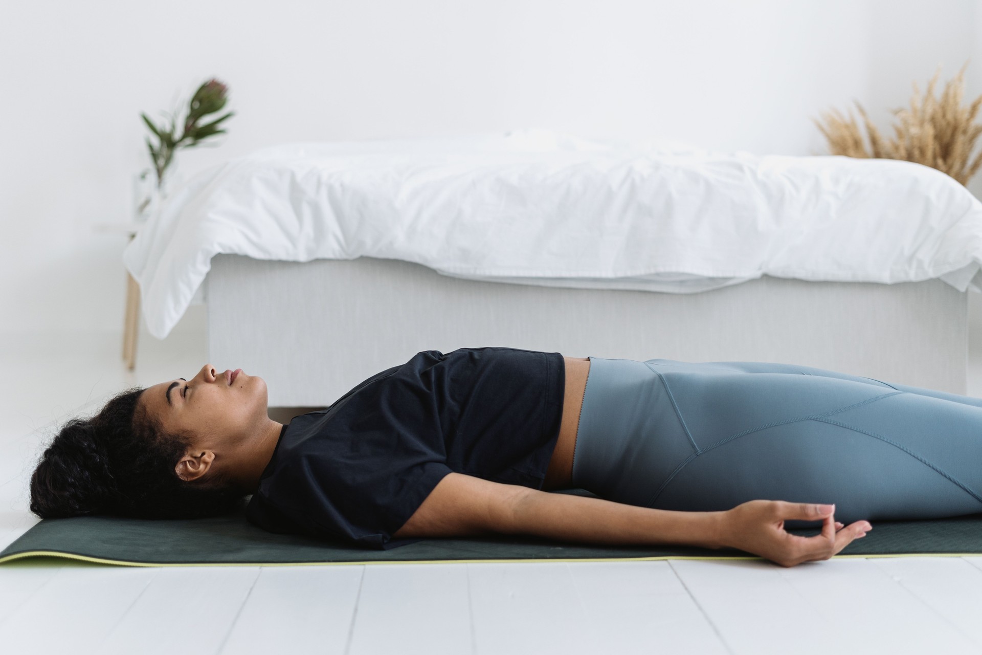 African american girl resting after sport training at home